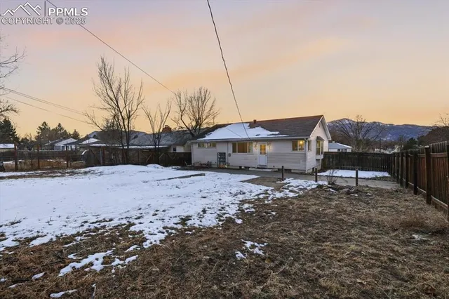 an aerial view of multiple houses with yard
