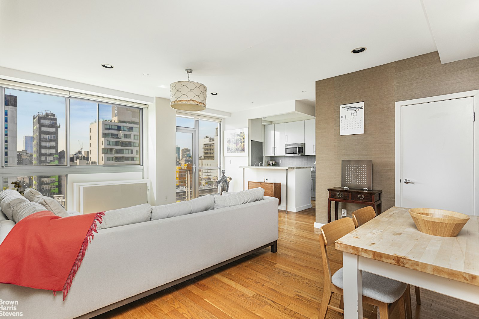 38 Delancey Street, Unit 10D Manhattan, NY 10002 - Photo 2 of 14 a living room with furniture and a table