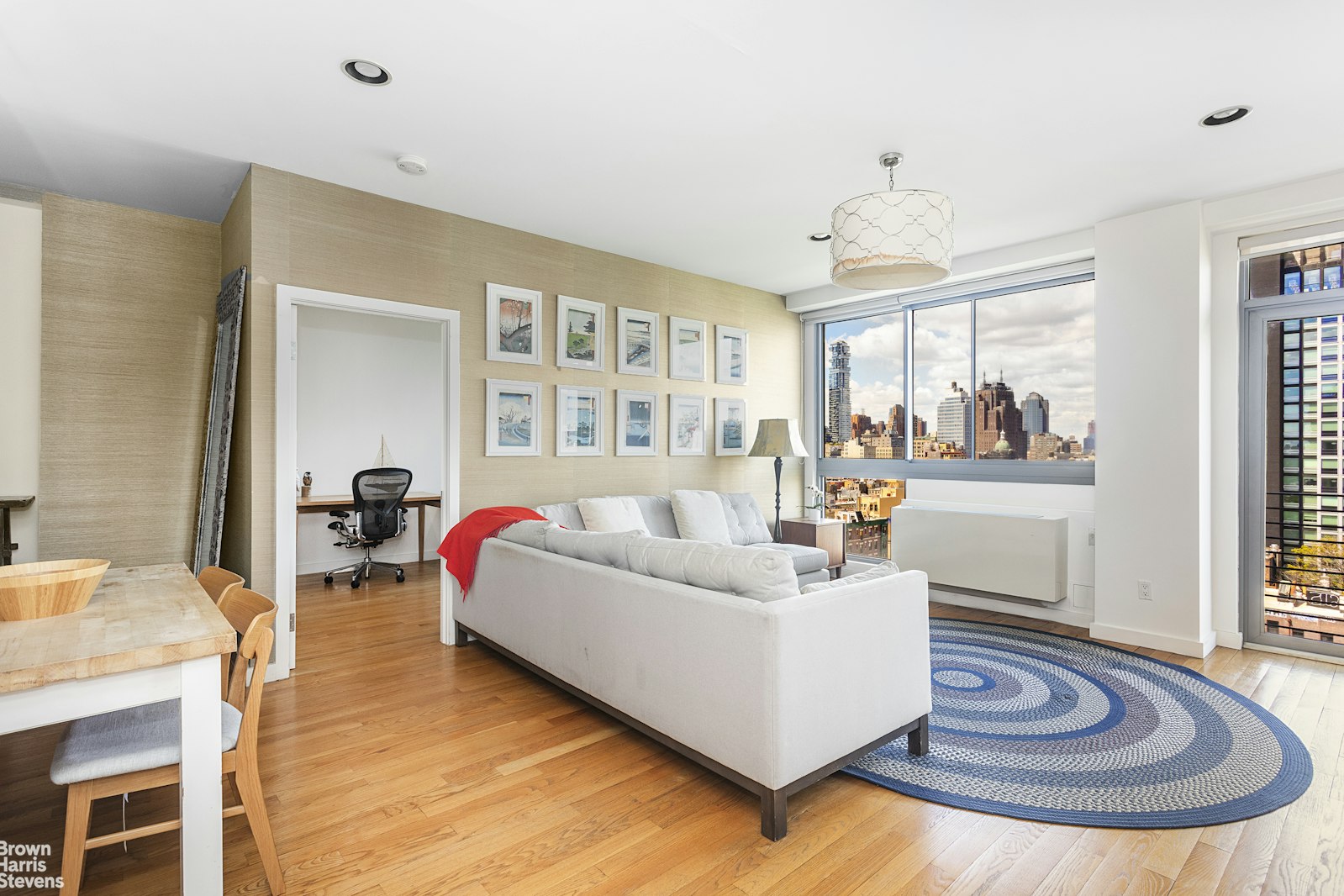 38 Delancey Street, Unit 10D Manhattan, NY 10002 - Photo 3 of 14 a living room with furniture and a fireplace