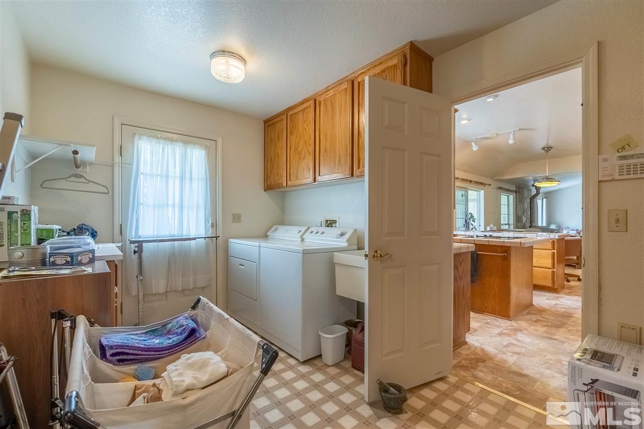 761 Rubio Way Gardnerville, NV 89460 - Photo 12 of 30 a room with furniture a rug and a window