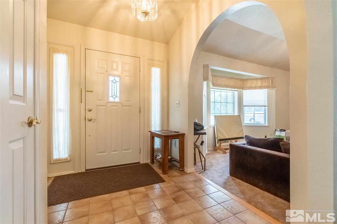 761 Rubio Way Gardnerville, NV 89460 - Photo 18 of 30 a view of a livingroom with furniture and windows