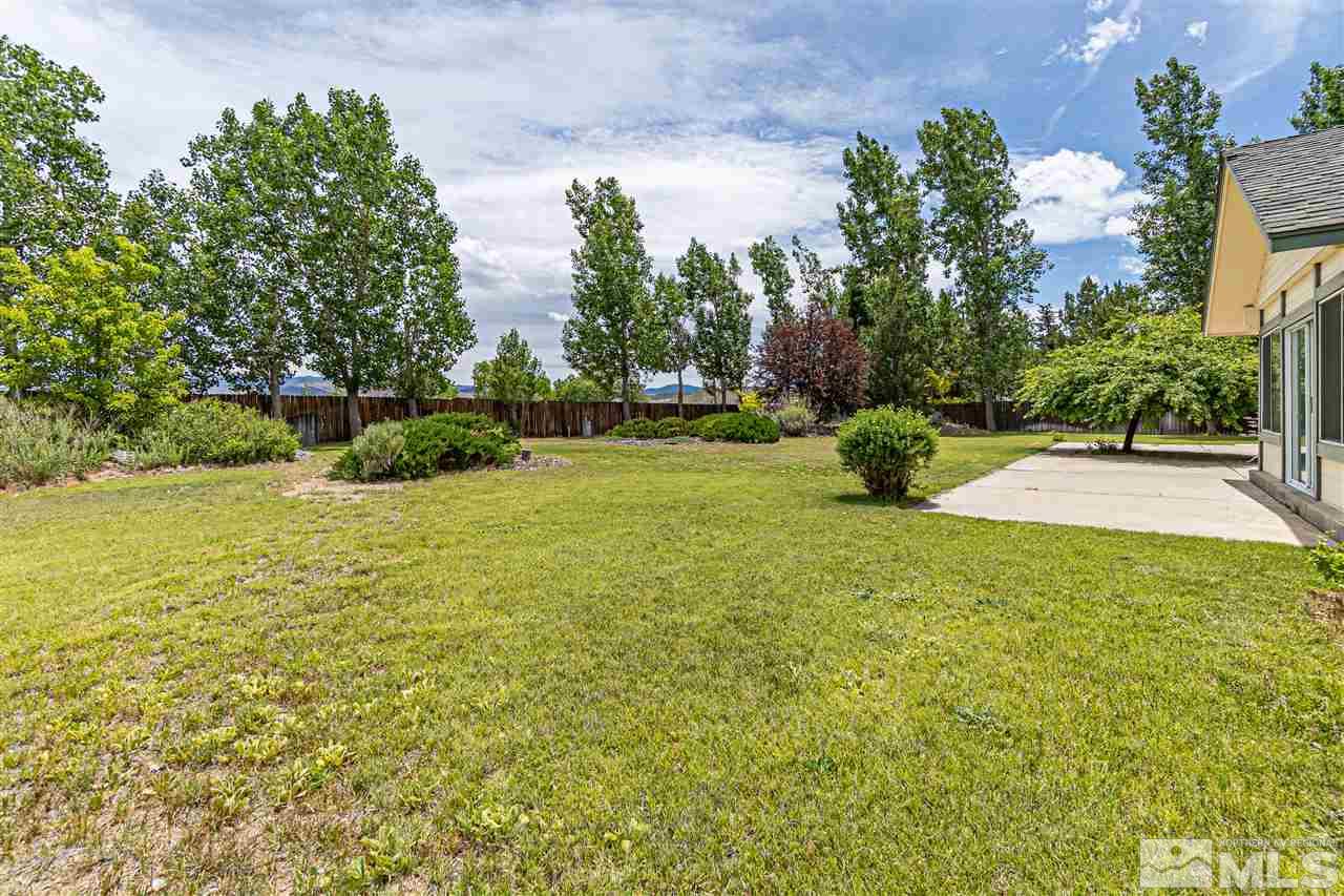 761 Rubio Way Gardnerville, NV 89460 - Photo 26 of 30 a view of yard with swimming pool and green space