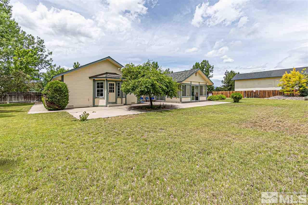 761 Rubio Way Gardnerville, NV 89460 - Photo 28 of 30 a house with huge green field in front of it