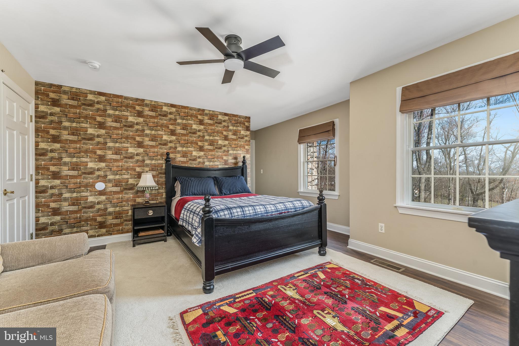 27 Milestone Drive Ringoes, NJ 08551 - Photo 39 of 75 a living room with a couch a rug and a fireplace