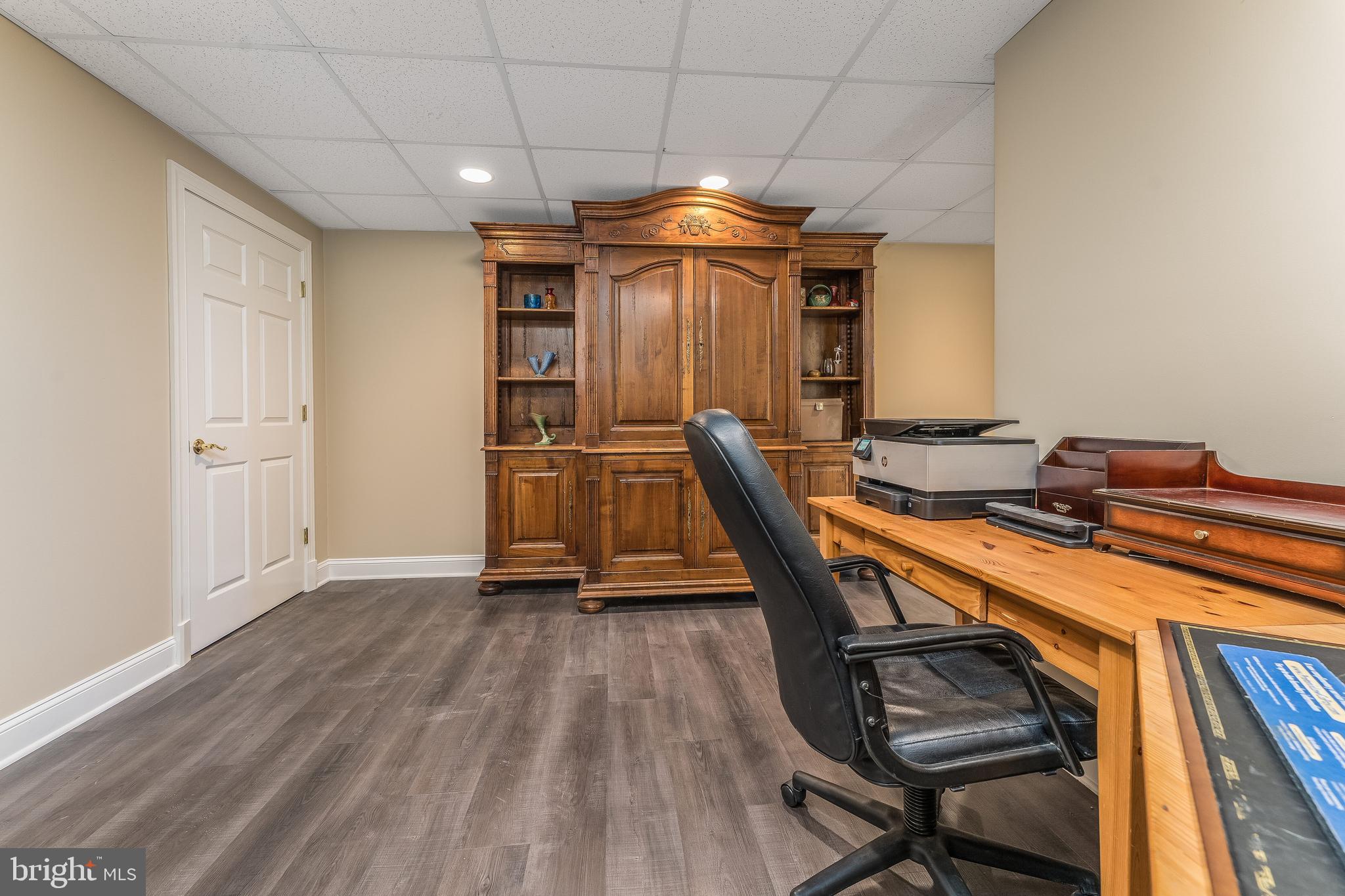 27 Milestone Drive Ringoes, NJ 08551 - Photo 47 of 75 a room with gym equipment and wooden floor
