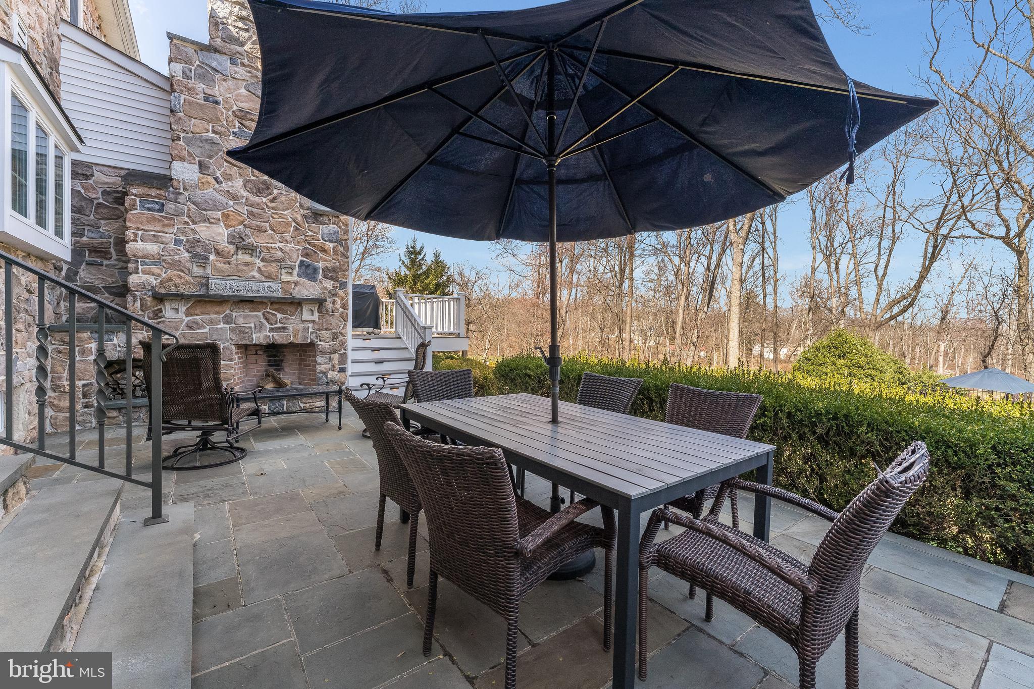27 Milestone Drive Ringoes, NJ 08551 - Photo 56 of 75 a view of an outdoor space with furniture and umbrella
