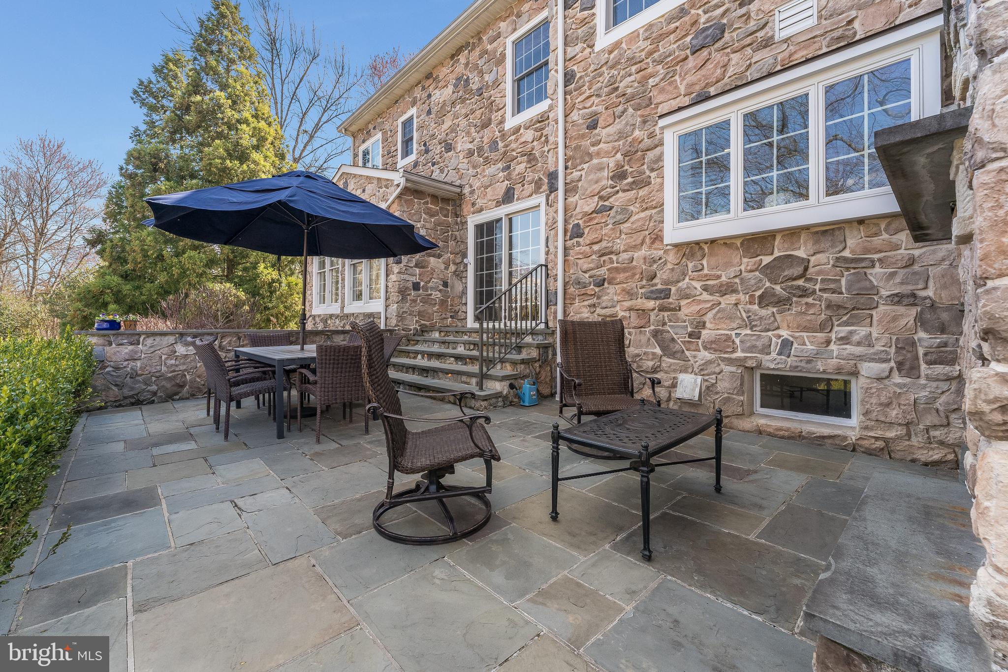 27 Milestone Drive Ringoes, NJ 08551 - Photo 59 of 75 a view of a chairs and table under an umbrella in the patio