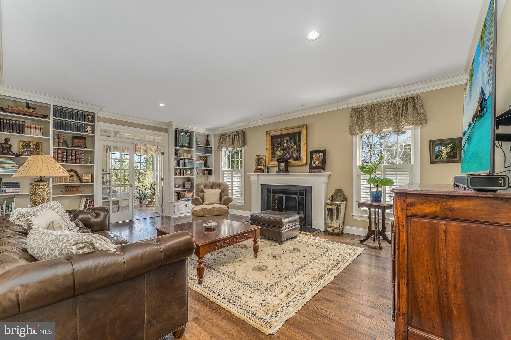 27 Milestone Drive Ringoes, NJ 08551 - Photo 9 of 75 a living room with furniture a fireplace and a table
