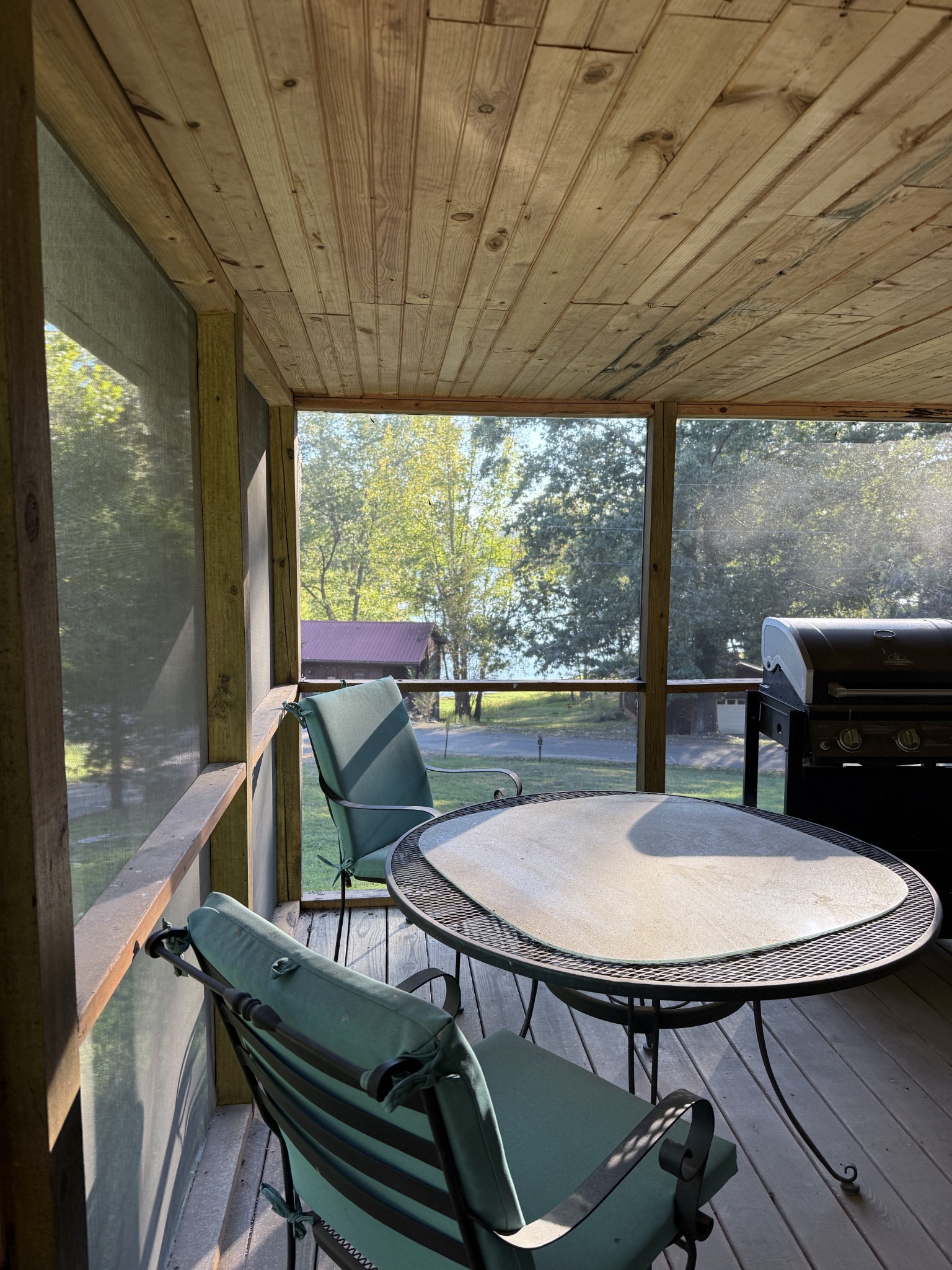 240 Doe Run Road Bumpus Mills, TN 37028 - Photo 2 of 3 a view of a balcony with table and chairs