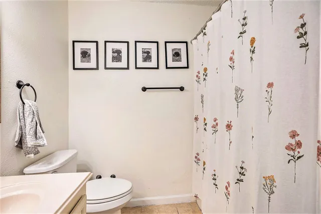 a spacious bathroom with a double vanity sink and a mirror