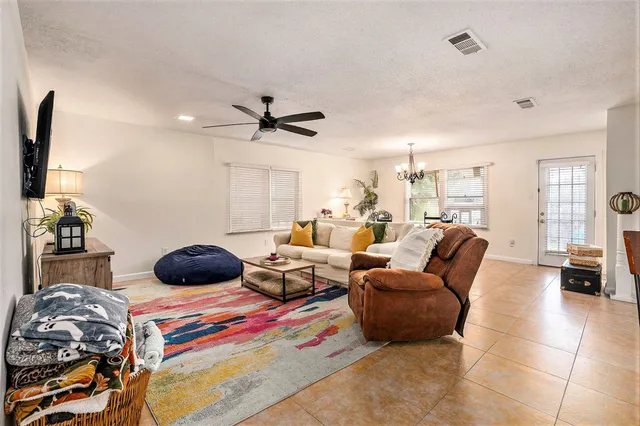 a bedroom with furniture and a large window