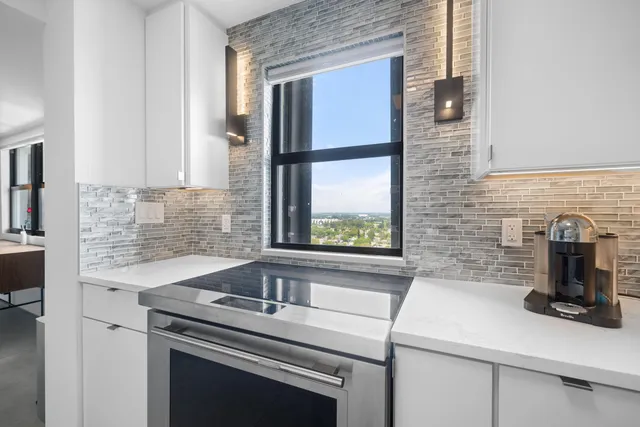 a kitchen with a sink and a window