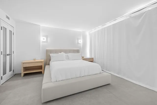 a bedroom with a bed and closet