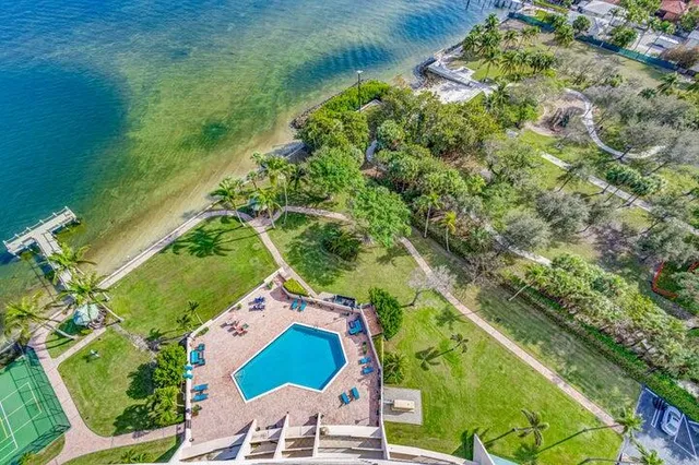 a view of a swimming pool and lounge chair