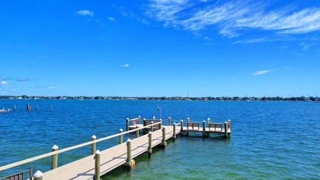 a view of a house with a swimming pool and a yard