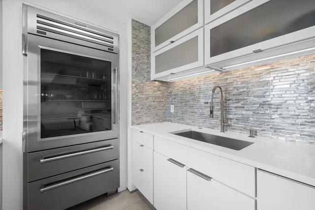 a bathroom with a sink and a granite counter top