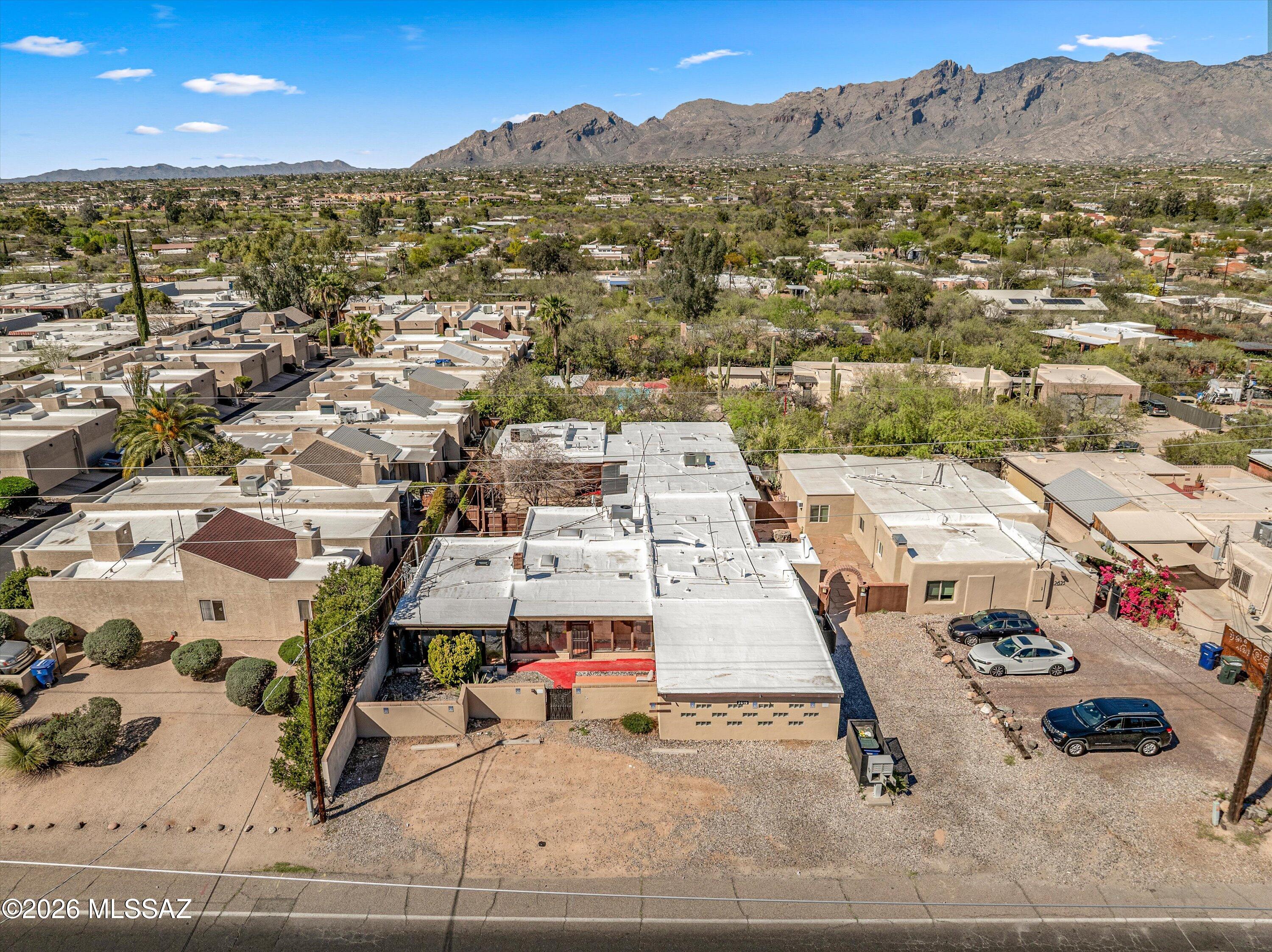 2619 East Prince Road Tucson, AZ 85716 - Photo 2 of 50 an aerial view of residential houses and outdoor space