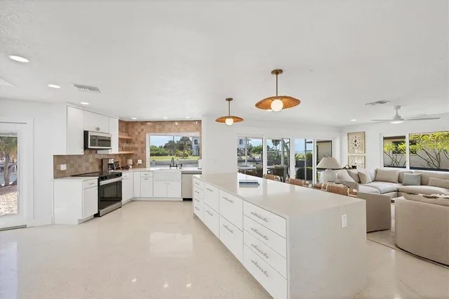 a large white room with cabinets