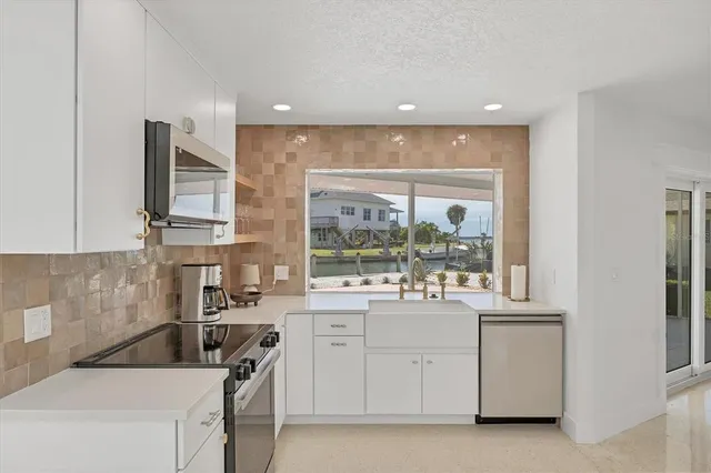 a bedroom with a bed mirror and window