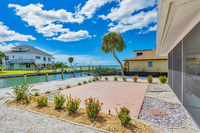 a view of a swimming pool and lounge chair