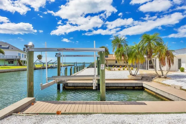 a aerial view of a house with yard swimming pool and outdoor seating