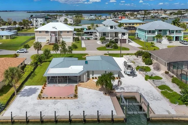 an aerial view of a house with a ocean view