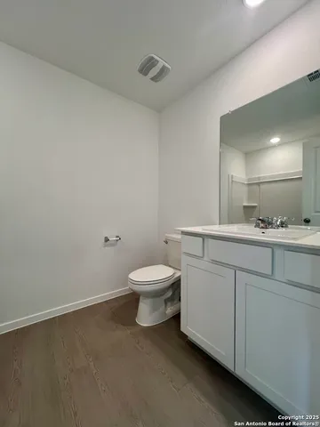 a view of a kitchen with microwave and cabinets