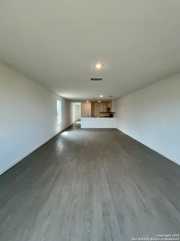 a bathroom with a shower and a sink