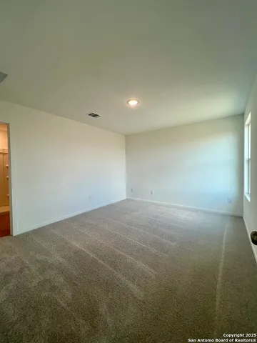 a room with a sink and mirror