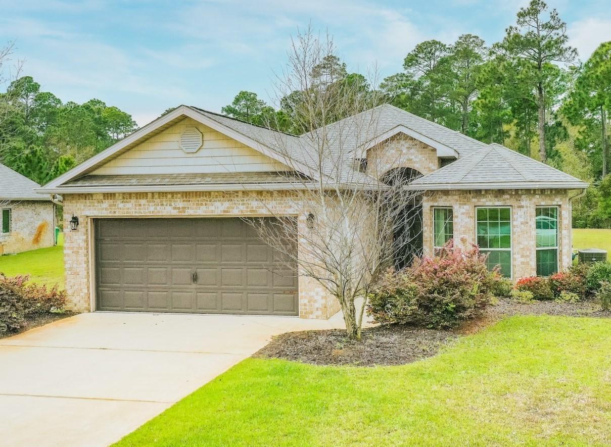 70 Riverbirch Loop Santa Rosa Beach, FL 32459 - Photo 1 of 45 a front view of a house with garden