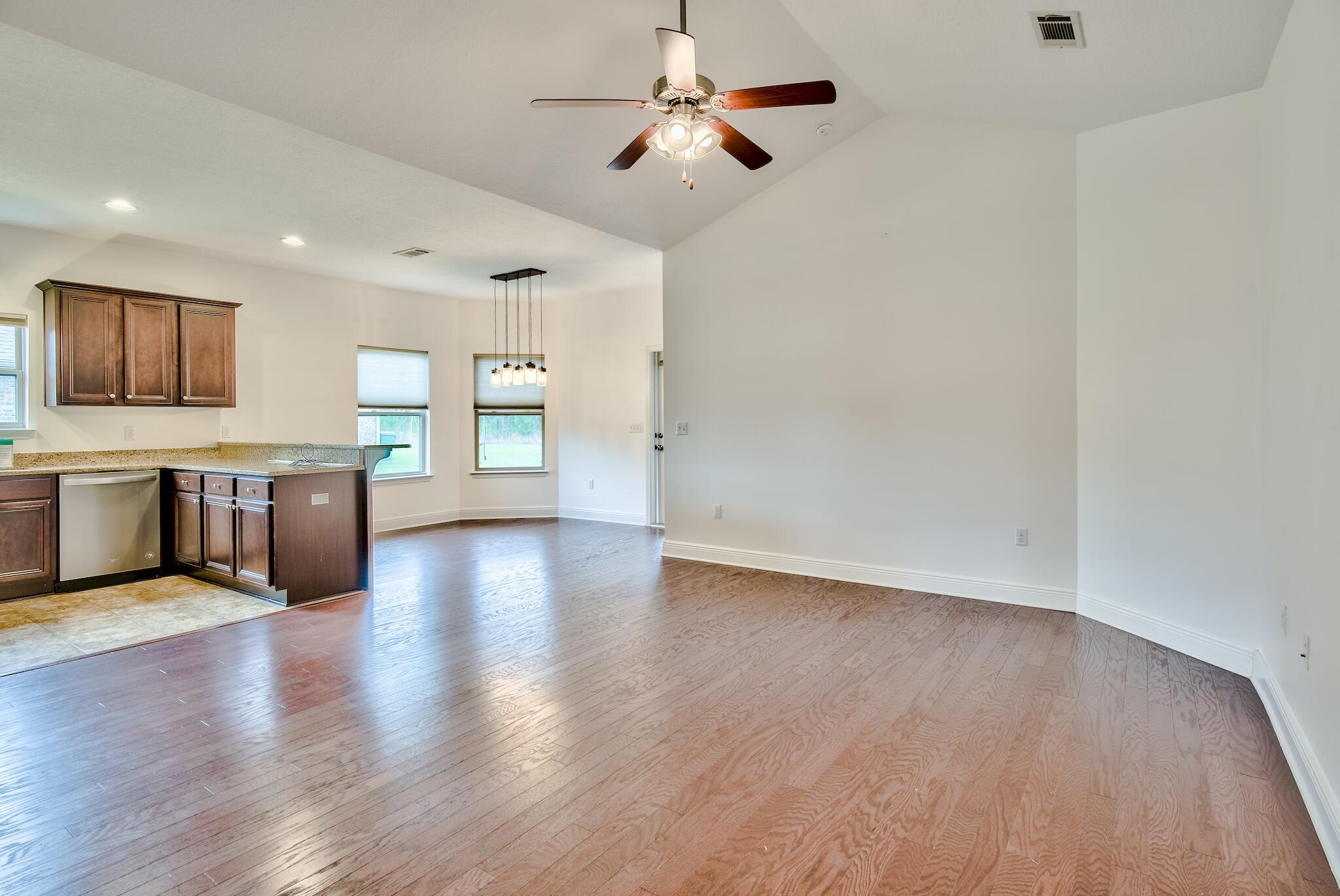 70 Riverbirch Loop Santa Rosa Beach, FL 32459 - Photo 2 of 45 a view of an empty room with window and wooden floor