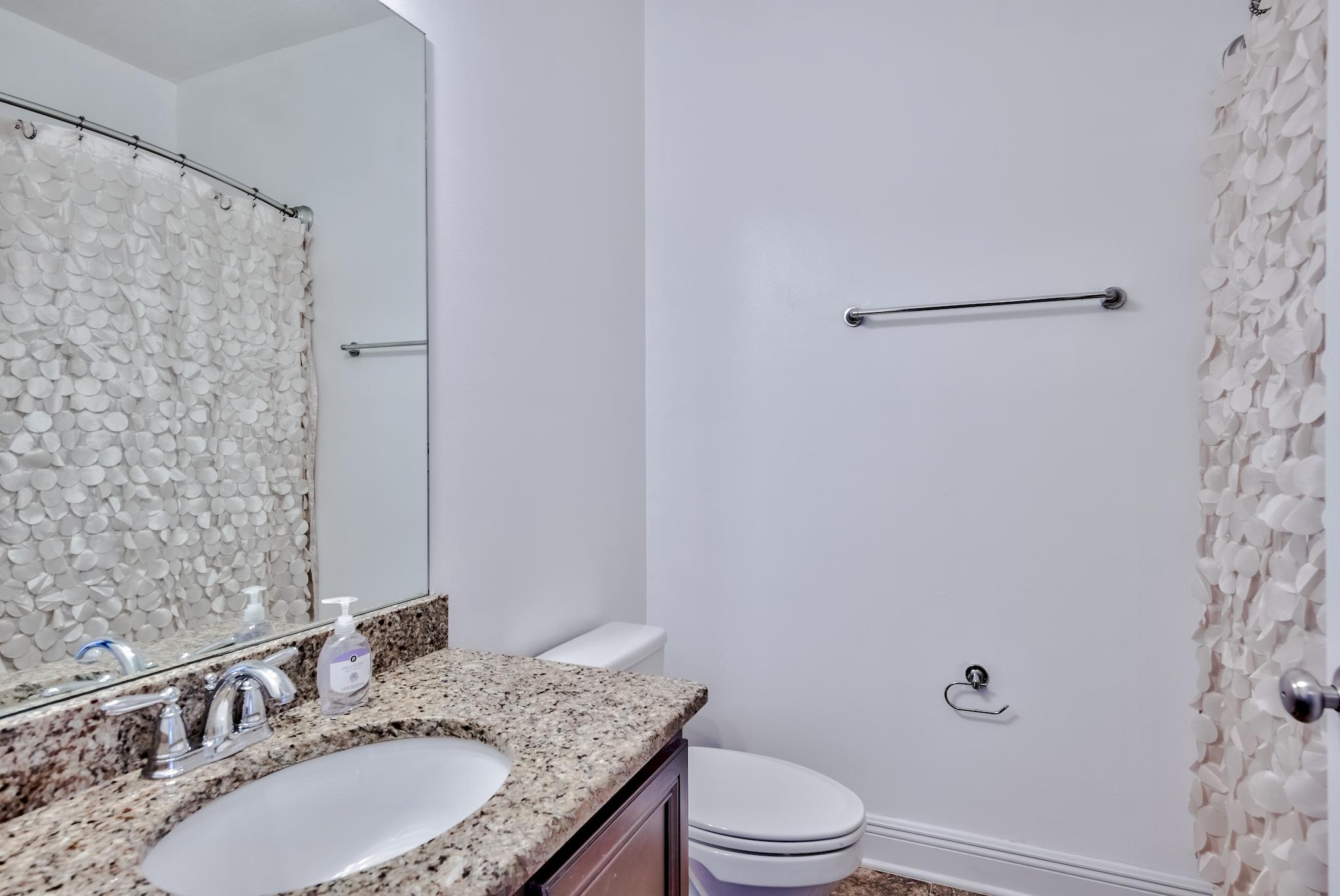 70 Riverbirch Loop Santa Rosa Beach, FL 32459 - Photo 19 of 45 a bathroom with a granite countertop sink toilet and shower
