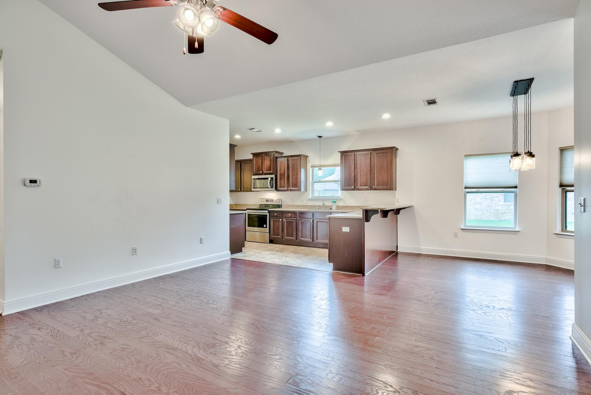70 Riverbirch Loop Santa Rosa Beach, FL 32459 - Photo 3 of 45 an open kitchen with window and wooden floor