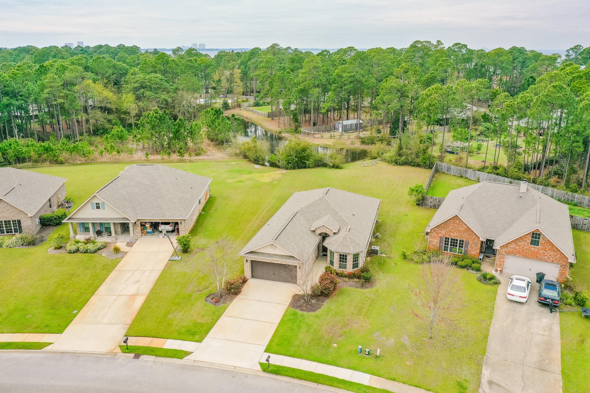 70 Riverbirch Loop Santa Rosa Beach, FL 32459 - Photo 26 of 45 an aerial view of a house with swimming pool and large trees