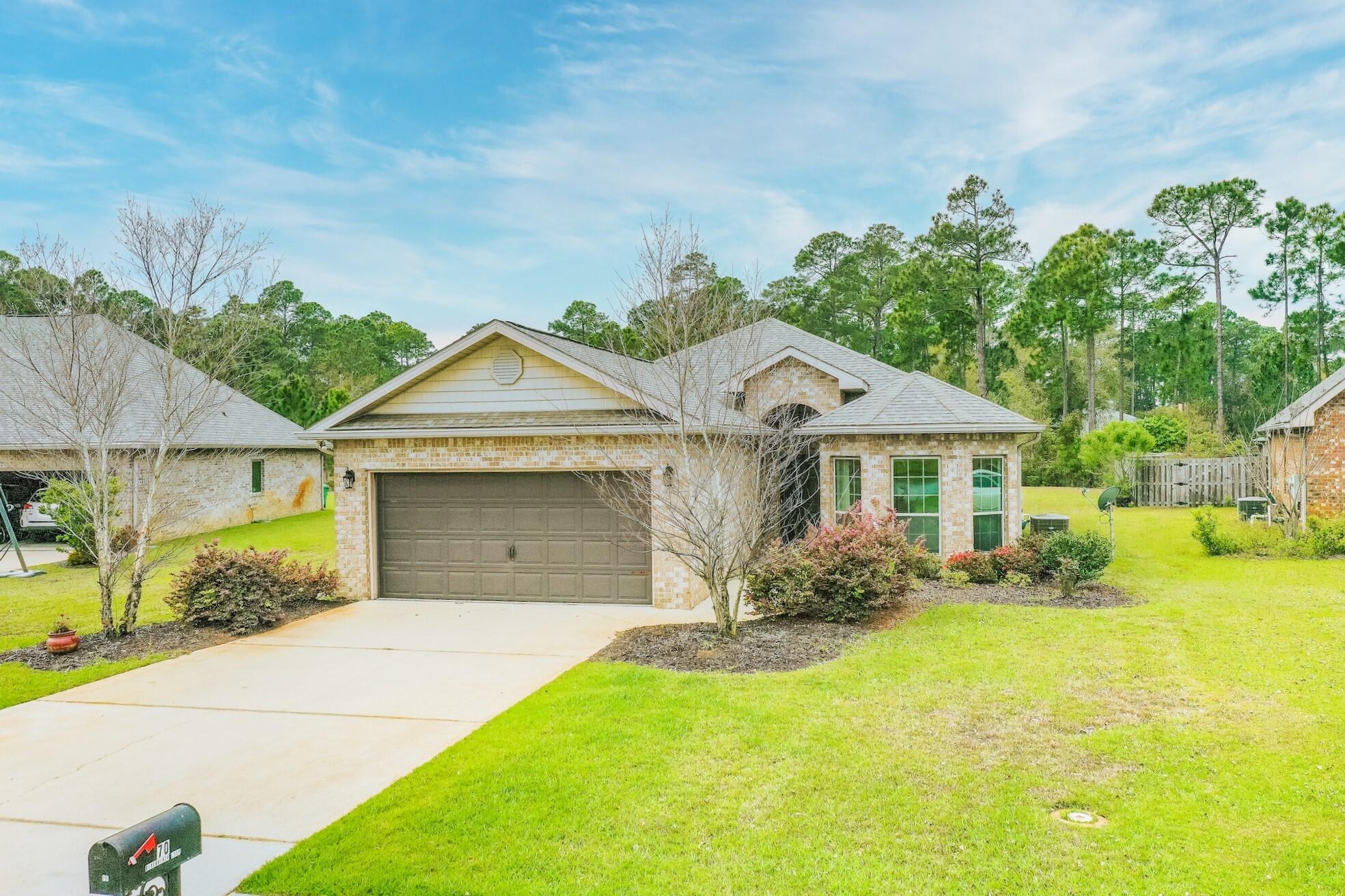 70 Riverbirch Loop Santa Rosa Beach, FL 32459 - Photo 32 of 45 a front view of a house with garden
