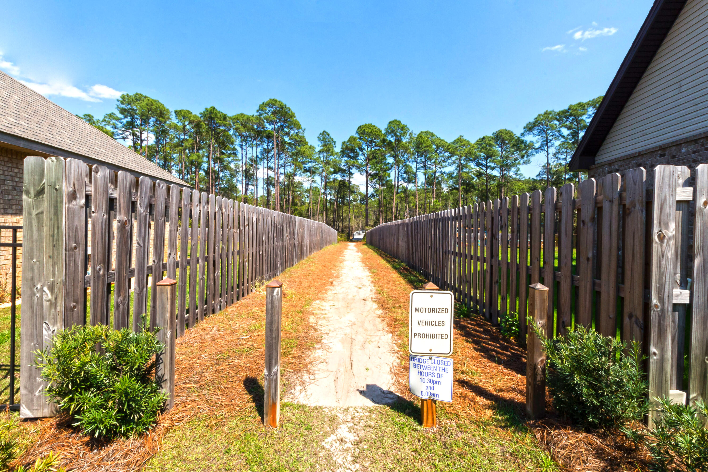 70 Riverbirch Loop Santa Rosa Beach, FL 32459 - Photo 39 of 45 a view of staircase with wooden fence and flowers