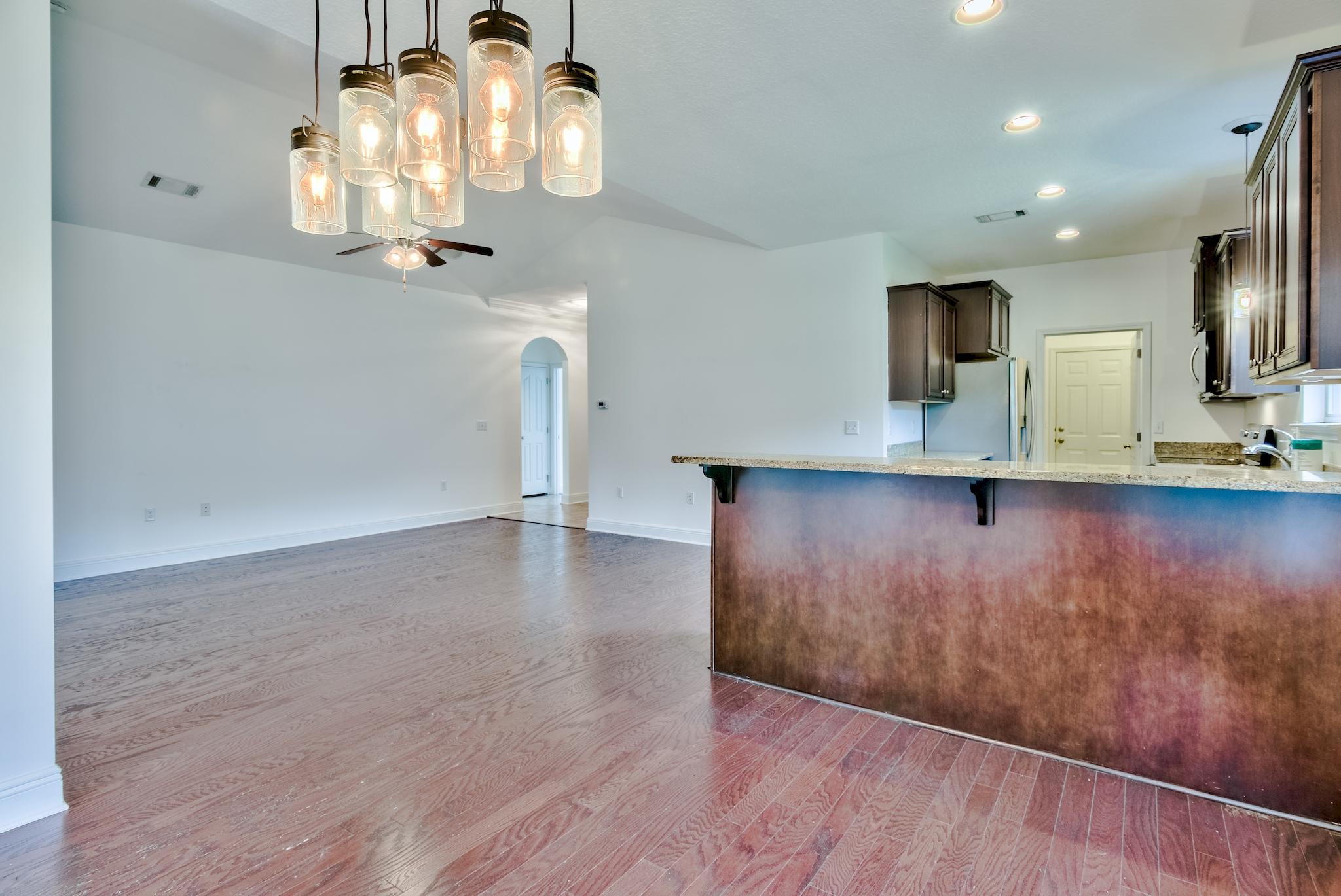 70 Riverbirch Loop Santa Rosa Beach, FL 32459 - Photo 5 of 45 a view of a kitchen with wooden floor