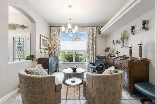 a kitchen with granite countertop a sink stainless steel appliances and white cabinets