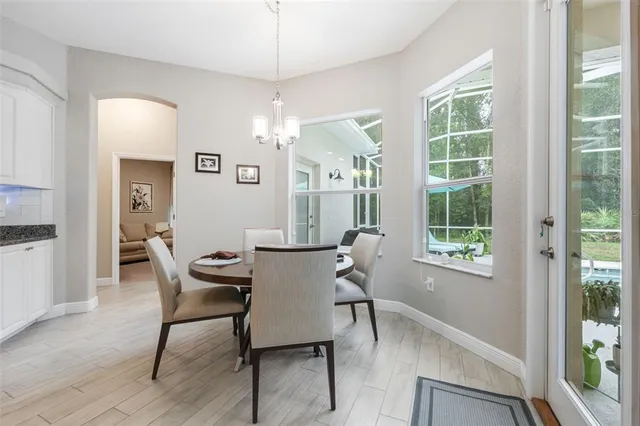 a bathroom with a granite countertop sink a mirror and a shower