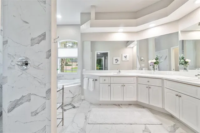 a swimming pool with outdoor seating and yard