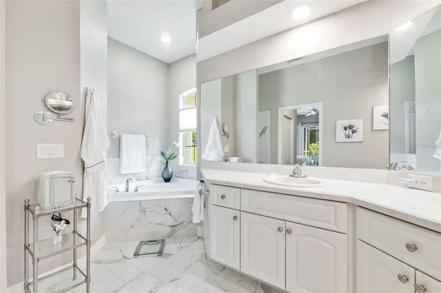 a view of a swimming pool with a patio and yard of the house