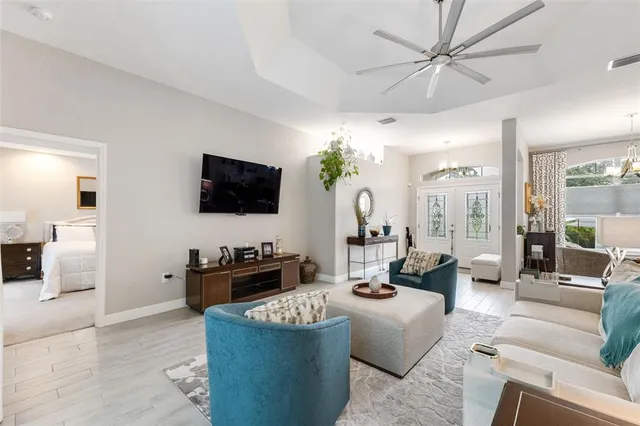 a living room with furniture and a large window