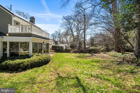 a front view of house with yard and seating area