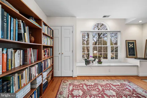 a view of an entryway with wooden floor and windows