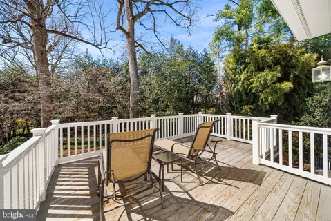 a spacious bedroom with a bed and a window