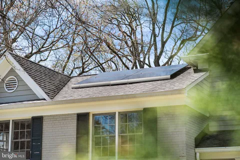 a view of porch with a door and wooden floor
