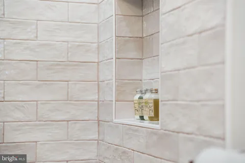 a view of a patio with table and chairs with wooden floor and fence