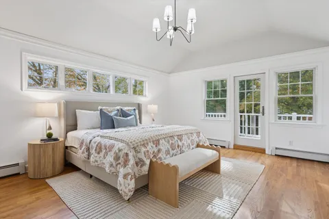 a bedroom with a large bed and a window