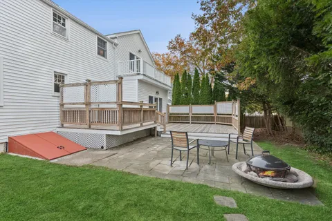 a view of a patio with a table and a chair