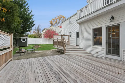 a view of outdoor space with deck and flat screen tv